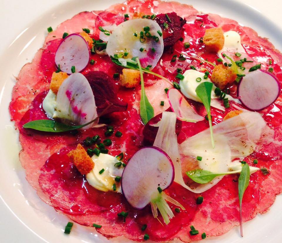 Beef Carpaccio dressed with Pepperberry in brine.